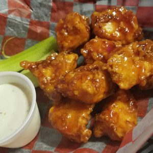 Jimmy B's boneless wings in basket with ranch