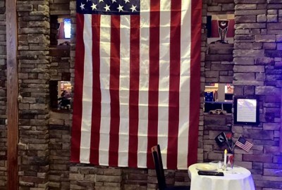 Flag at entrance to Jimmy B's paying respect to our veterans and US service personell